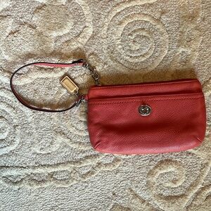 Pink coach leather wristlet